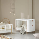 Oliver Furniture | Wood Mini+ Cot Bed Including Junior Kit in White/Oak - Bubba & Me