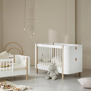 Oliver Furniture | Wood Mini+ Cot Bed Including Junior Kit in White/Oak - Bubba & Me